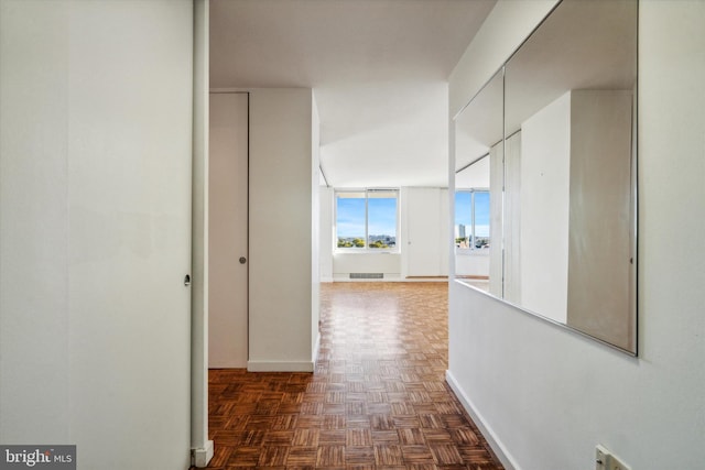 hall featuring dark parquet floors