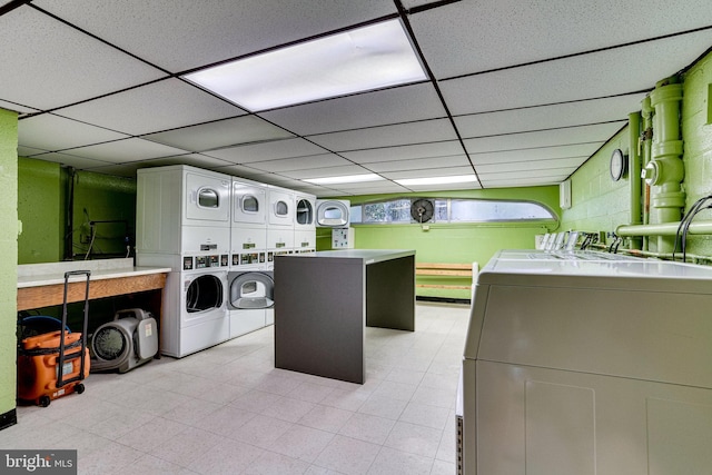 clothes washing area featuring separate washer and dryer and stacked washer / drying machine