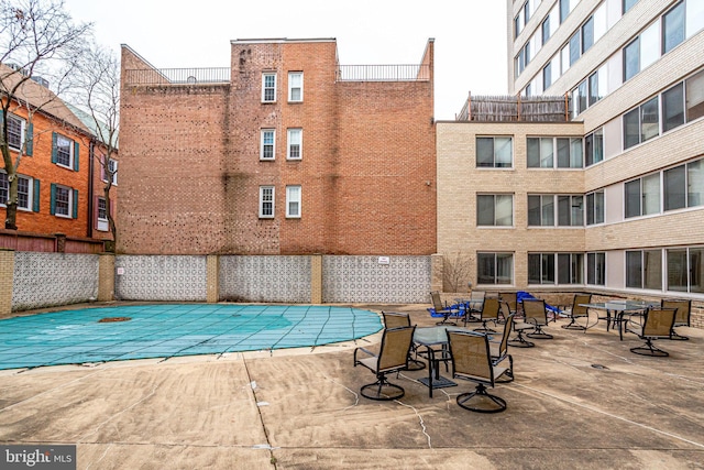 view of swimming pool with a patio