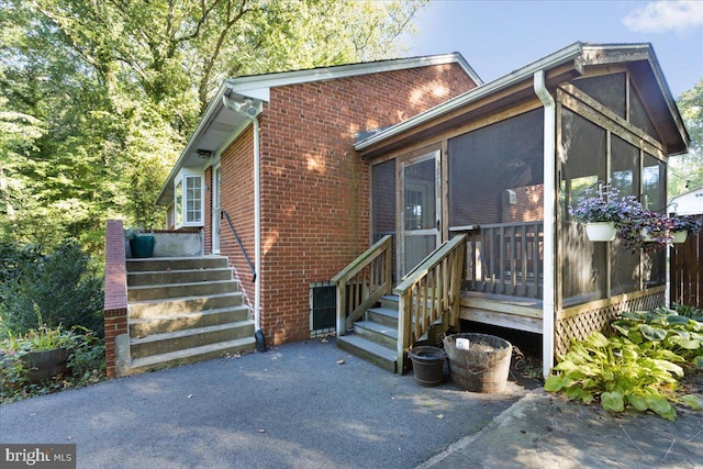 view of front of home with a sunroom