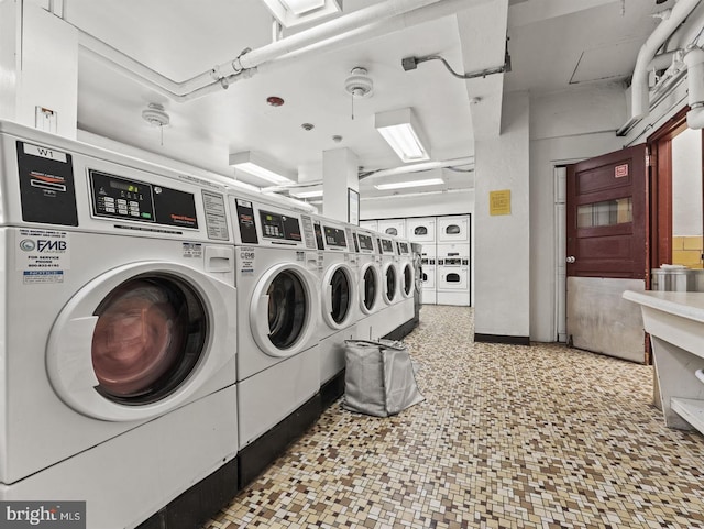 clothes washing area featuring separate washer and dryer