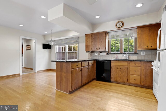 kitchen with kitchen peninsula, light wood-type flooring, backsplash, and dishwasher