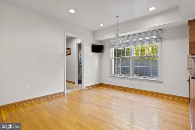 unfurnished dining area featuring light hardwood / wood-style floors