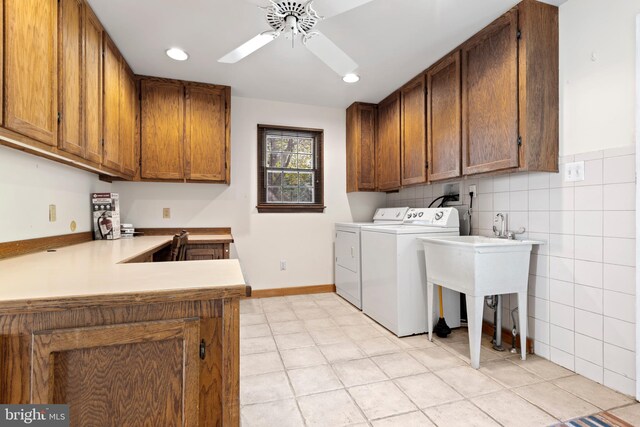 laundry room featuring ceiling fan, cabinets, independent washer and dryer, and light tile patterned flooring