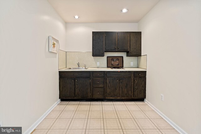 kitchen with sink and dark brown cabinets