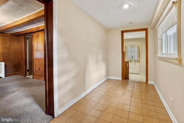 corridor with light tile patterned floors