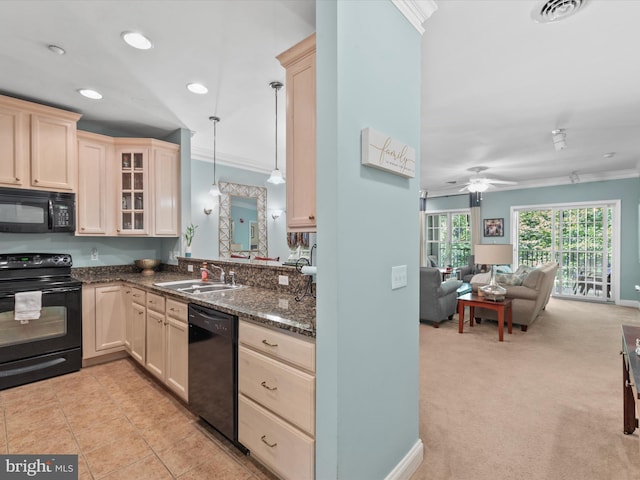 kitchen with black appliances, ceiling fan, light carpet, pendant lighting, and crown molding