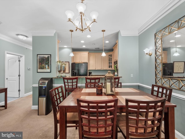 carpeted dining area with a notable chandelier and ornamental molding