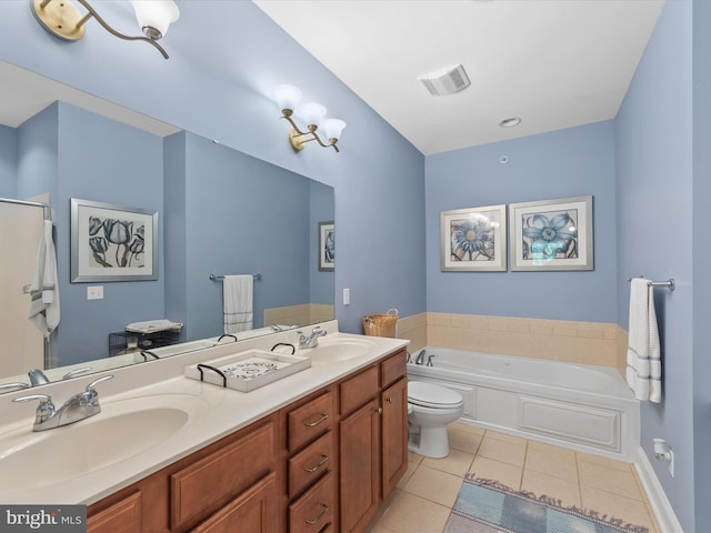 bathroom featuring toilet, tile patterned flooring, a washtub, and vanity