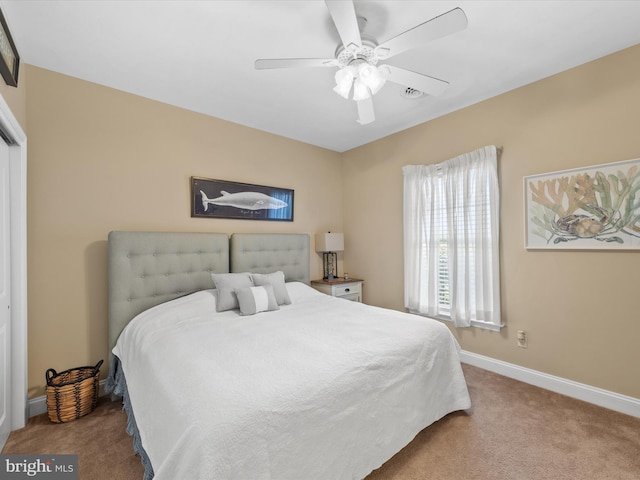 carpeted bedroom featuring ceiling fan