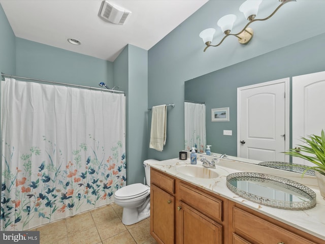 bathroom featuring curtained shower, tile patterned floors, vanity, and toilet