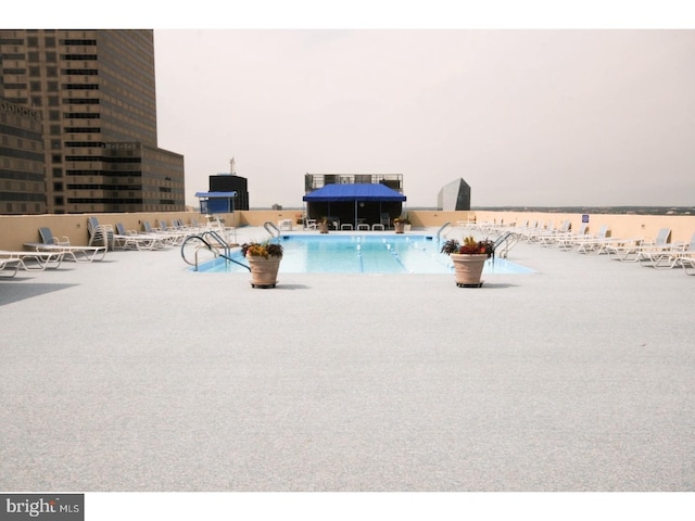 view of swimming pool featuring a patio