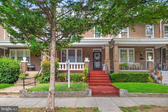 multi unit property featuring covered porch