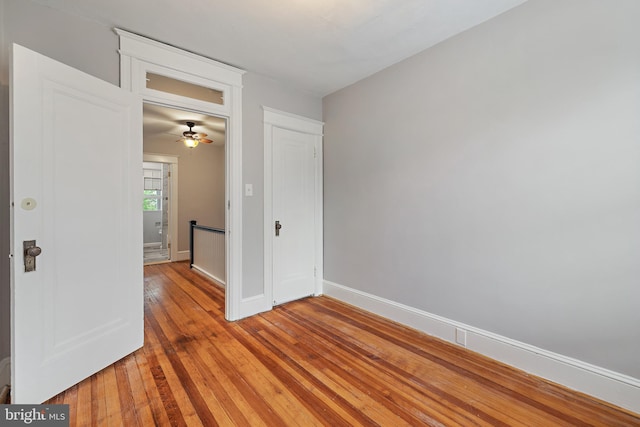 unfurnished room with ceiling fan and light hardwood / wood-style floors