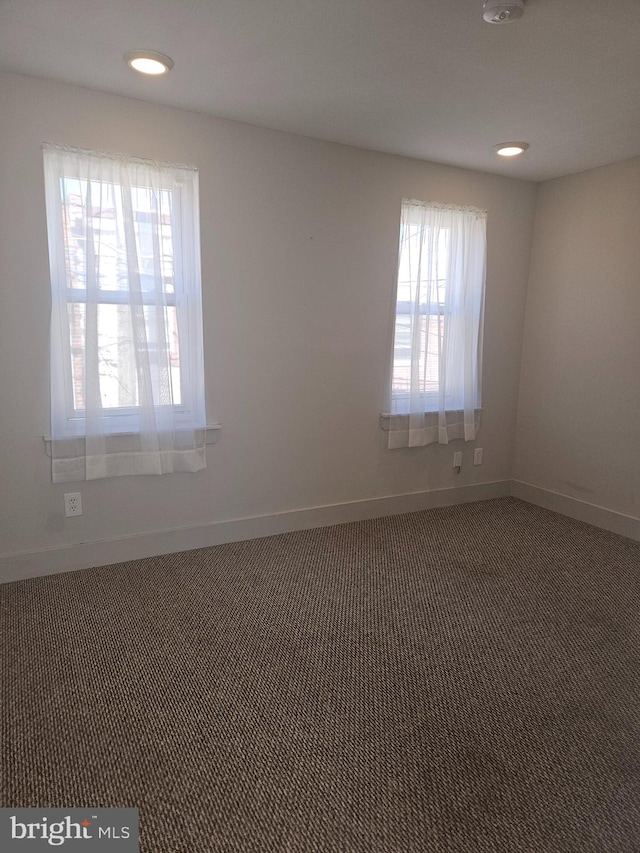 spare room featuring carpet floors