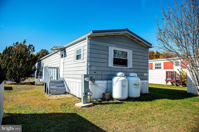 view of property exterior featuring a yard