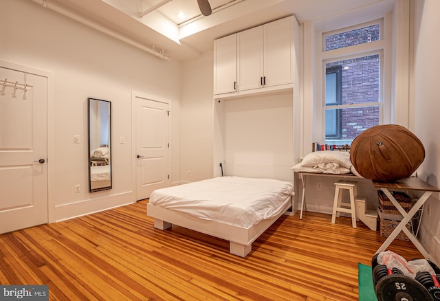 bedroom featuring ceiling fan and light hardwood / wood-style floors