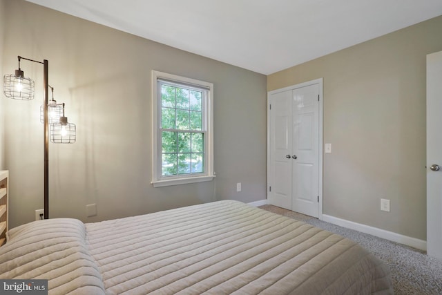 carpeted bedroom with a closet