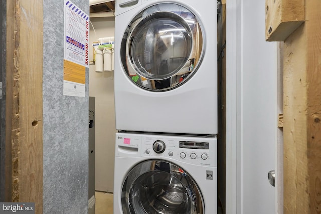 washroom with stacked washer / dryer