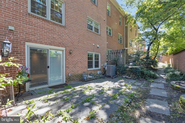 back of property featuring central AC and a patio