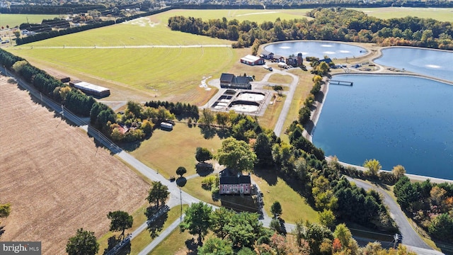 bird's eye view with a water view and a rural view