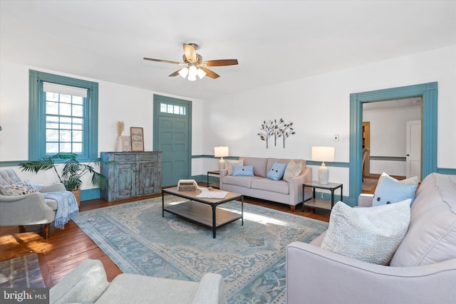 living room with ceiling fan and wood-type flooring