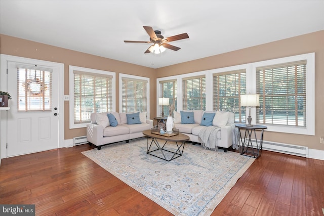 living room with a baseboard radiator, dark wood-type flooring, and ceiling fan