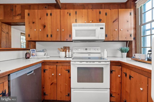 kitchen with plenty of natural light and white appliances