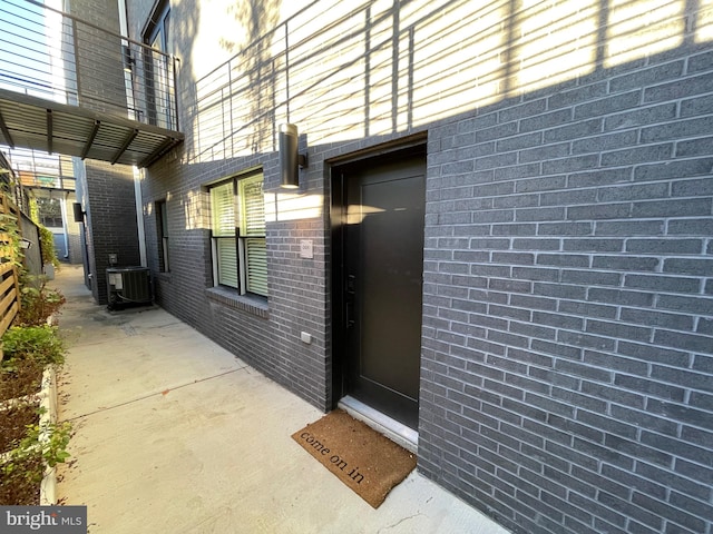 entrance to property featuring central AC unit