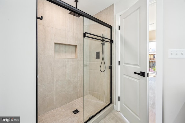 bathroom featuring an enclosed shower