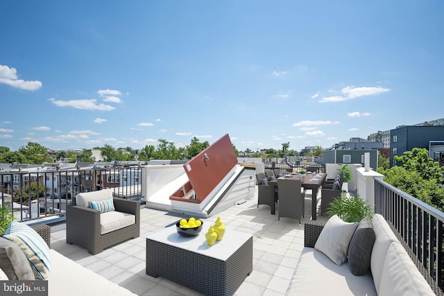 view of patio featuring a balcony and an outdoor hangout area