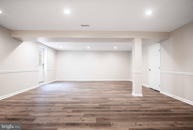 basement featuring dark wood-type flooring