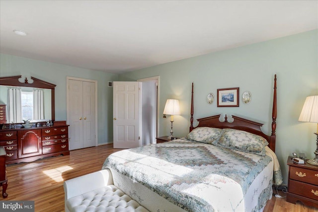 bedroom featuring a closet and light hardwood / wood-style flooring