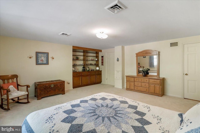 bedroom featuring light carpet