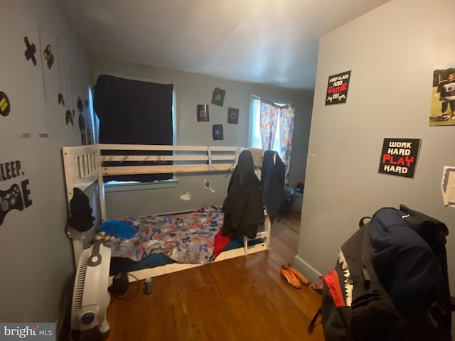 bedroom featuring wood-type flooring