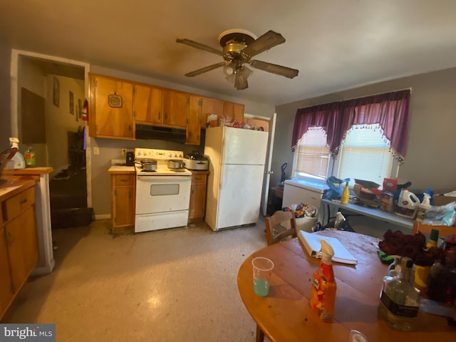 kitchen with white appliances and ceiling fan