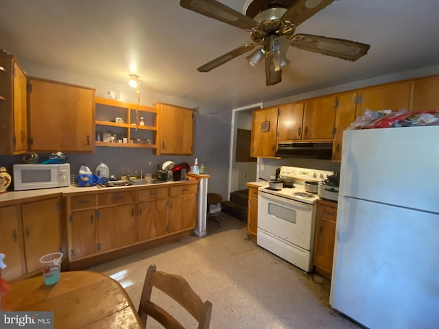 kitchen featuring ceiling fan, sink, and white appliances