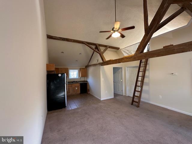 unfurnished living room with high vaulted ceiling, ceiling fan, carpet, baseboards, and beam ceiling