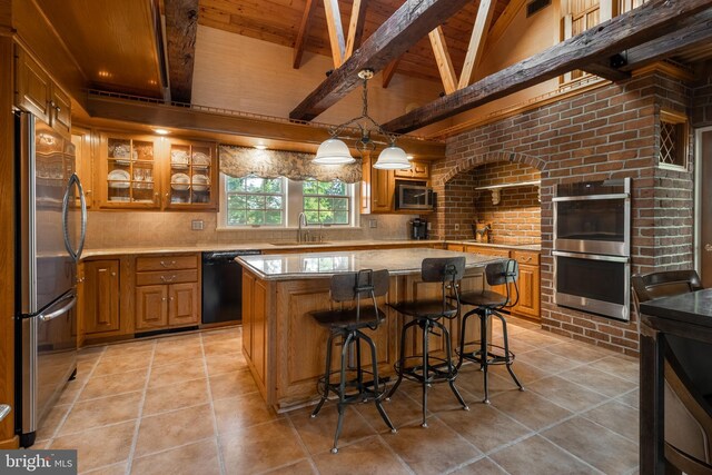 tiled dining space featuring a notable chandelier, beam ceiling, and high vaulted ceiling