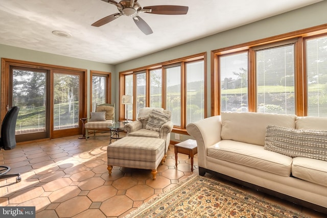 sunroom featuring ceiling fan