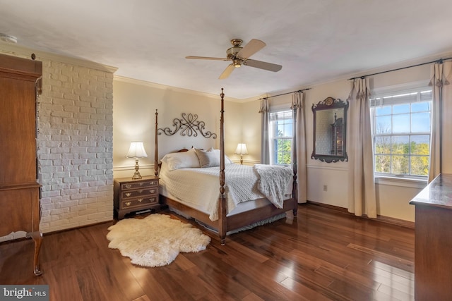 bedroom with crown molding, dark hardwood / wood-style flooring, multiple windows, and ceiling fan