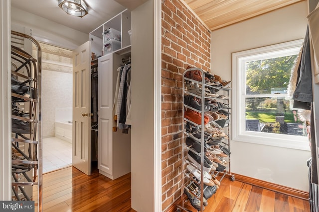 walk in closet featuring hardwood / wood-style floors