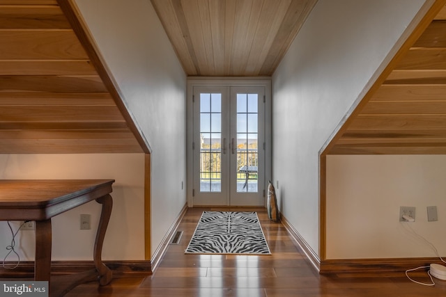 doorway to outside featuring french doors, dark hardwood / wood-style floors, and wooden ceiling