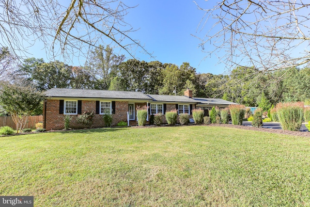 single story home featuring a front yard