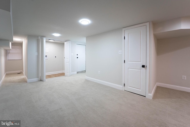 basement with light colored carpet