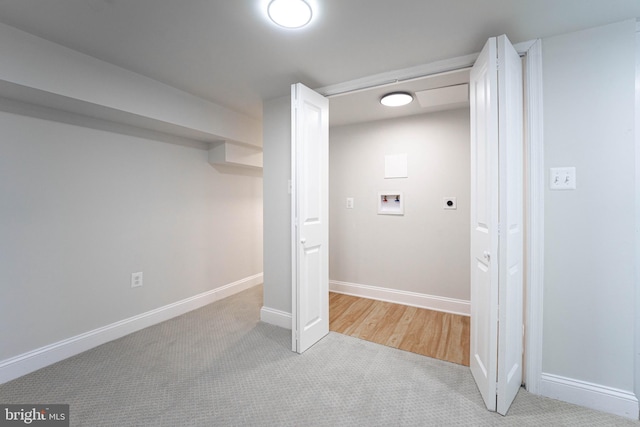 basement featuring light colored carpet