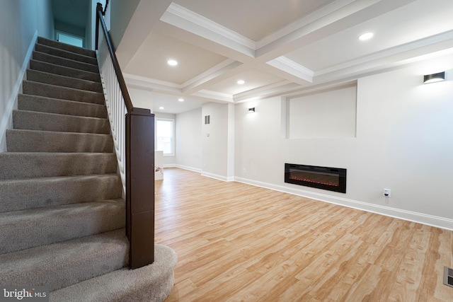 basement featuring crown molding, heating unit, and hardwood / wood-style floors