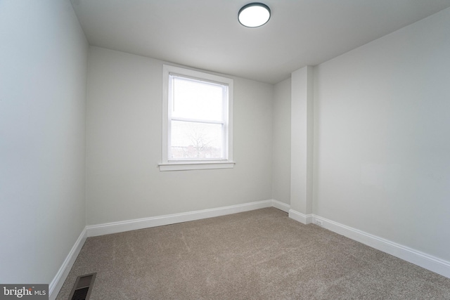 unfurnished room with carpet flooring