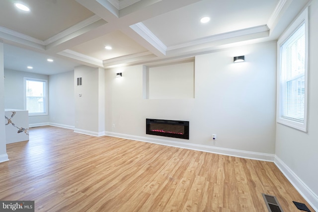 unfurnished living room with beamed ceiling, ornamental molding, coffered ceiling, and light hardwood / wood-style flooring