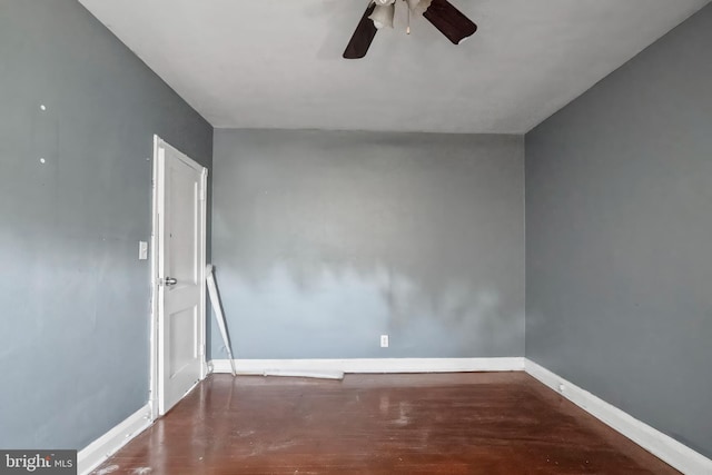 empty room with ceiling fan and hardwood / wood-style floors